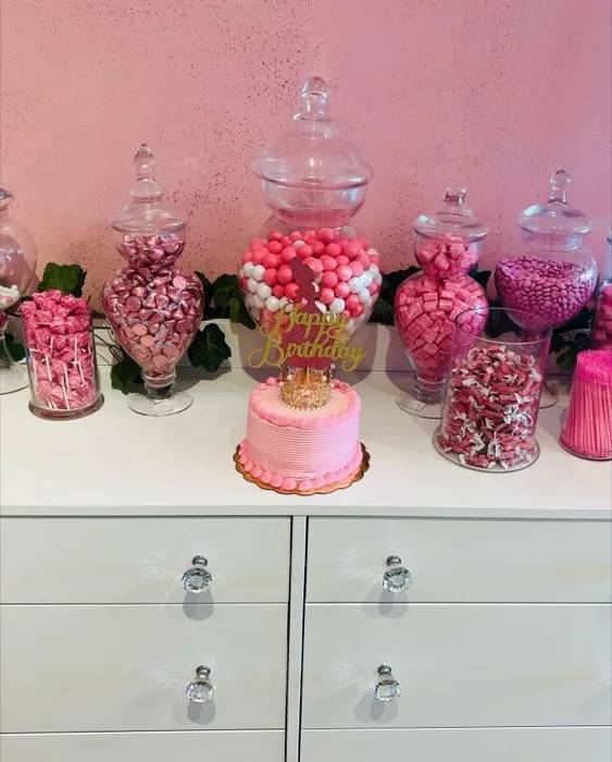 Pink candy and dessert display at a spa party