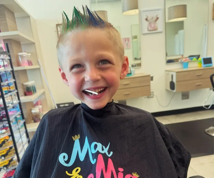 Boy with colorful spiked mohawk hairstyle