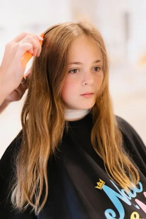 Girl having her hair styled at Max & Mia